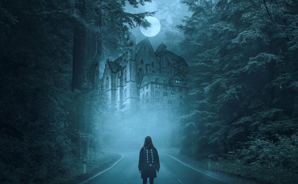 Woman with backpack standing in front of a haunted house during a full moon night