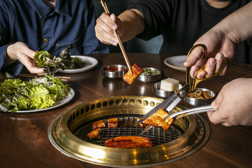 Pork belly on tableside grill (Photo Credit: Andrew Bezek)