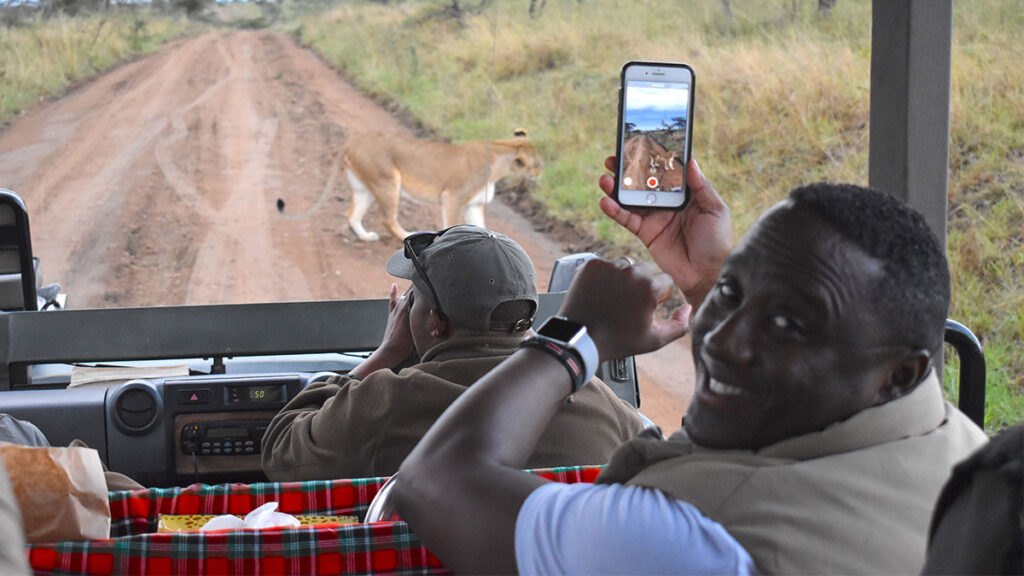 Sherwin Banda on a game drive in Tanzania (Photo Credit: African Travel, Inc.)