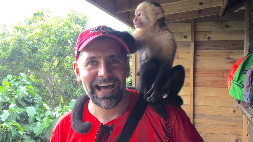 Eric Hope with a new friend on Roatán Island, Honduras (Photo Credit: Eric Hope)