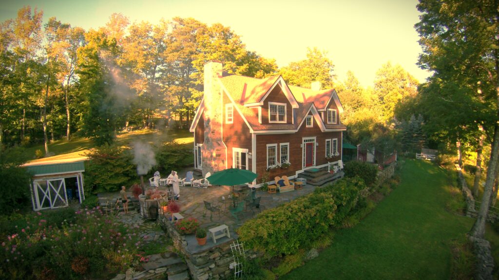 Frog Meadow’s timber frame Main House overlooks the gardens, swimming pond, meadows, and nearby mountains. (Photo Credit: Frog Meadow B&B and Oasis for Men)